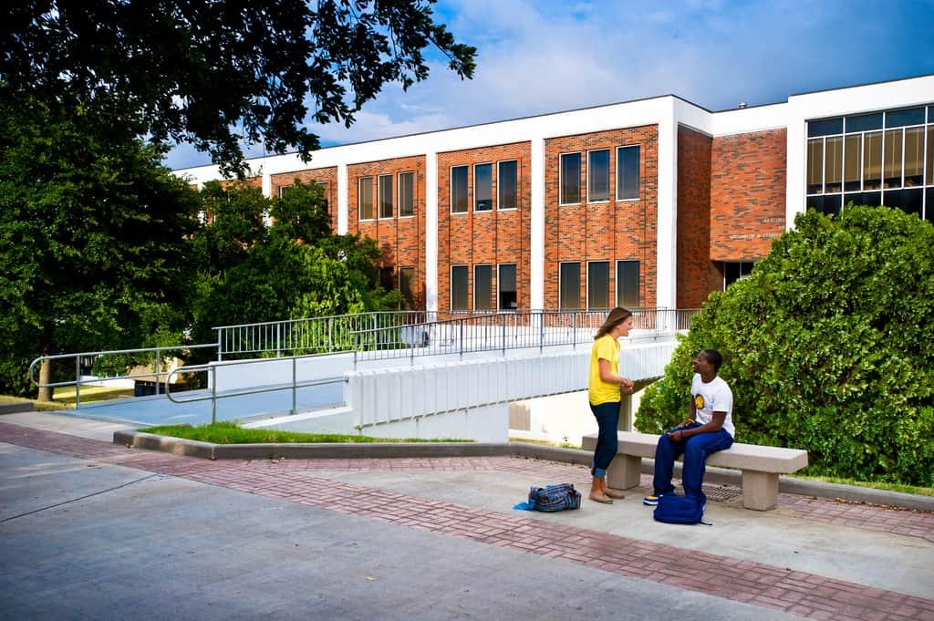students interacting background 'McDowell Administration Building'