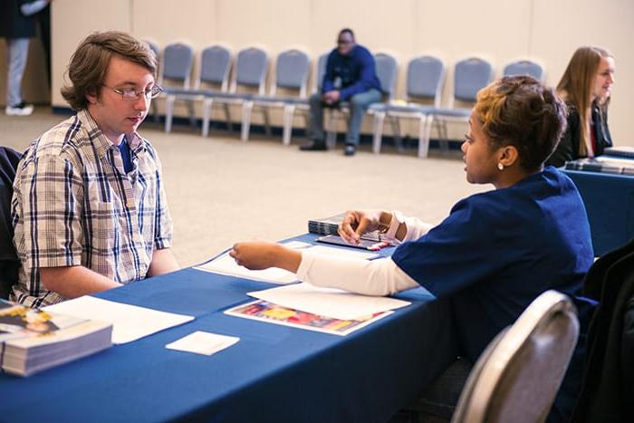 A student talking to a health professional.