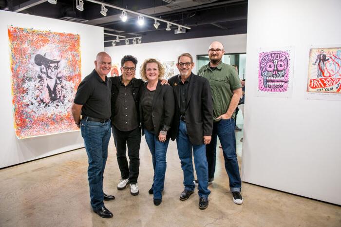 Faculty of the art department in a gallery. Starting from the left Joshua Ege, Virgil Scott, Lee Hackett, Carlos Hernandez and Casey McGarr.