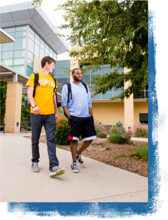 Two student walking on campus.