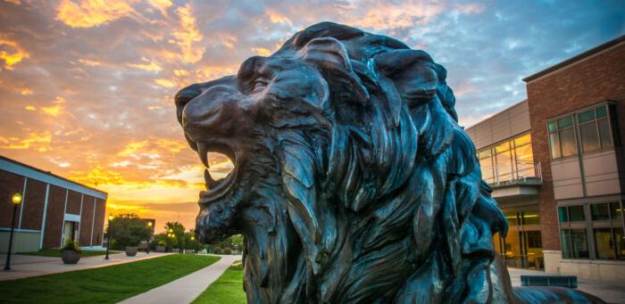 TAMUC lion statue at dusk