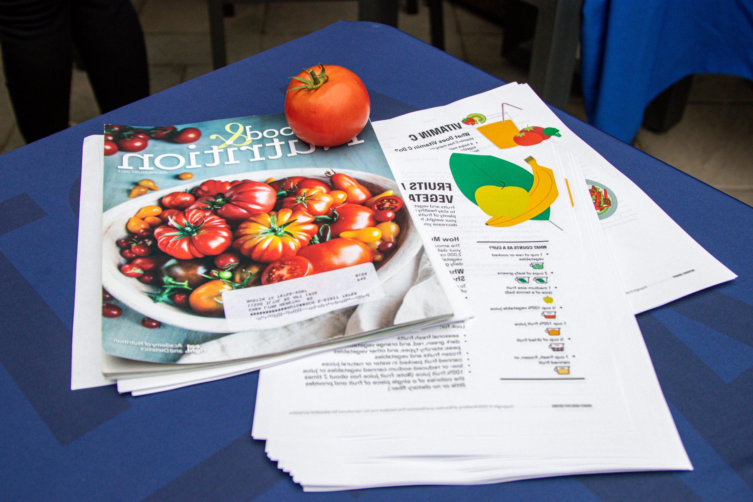 A table filled with cooking magazine and nutrition