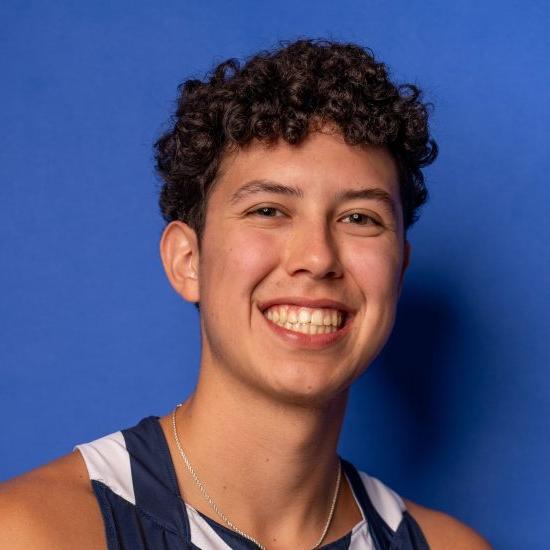 A student-athlete poses for a headshot photo.